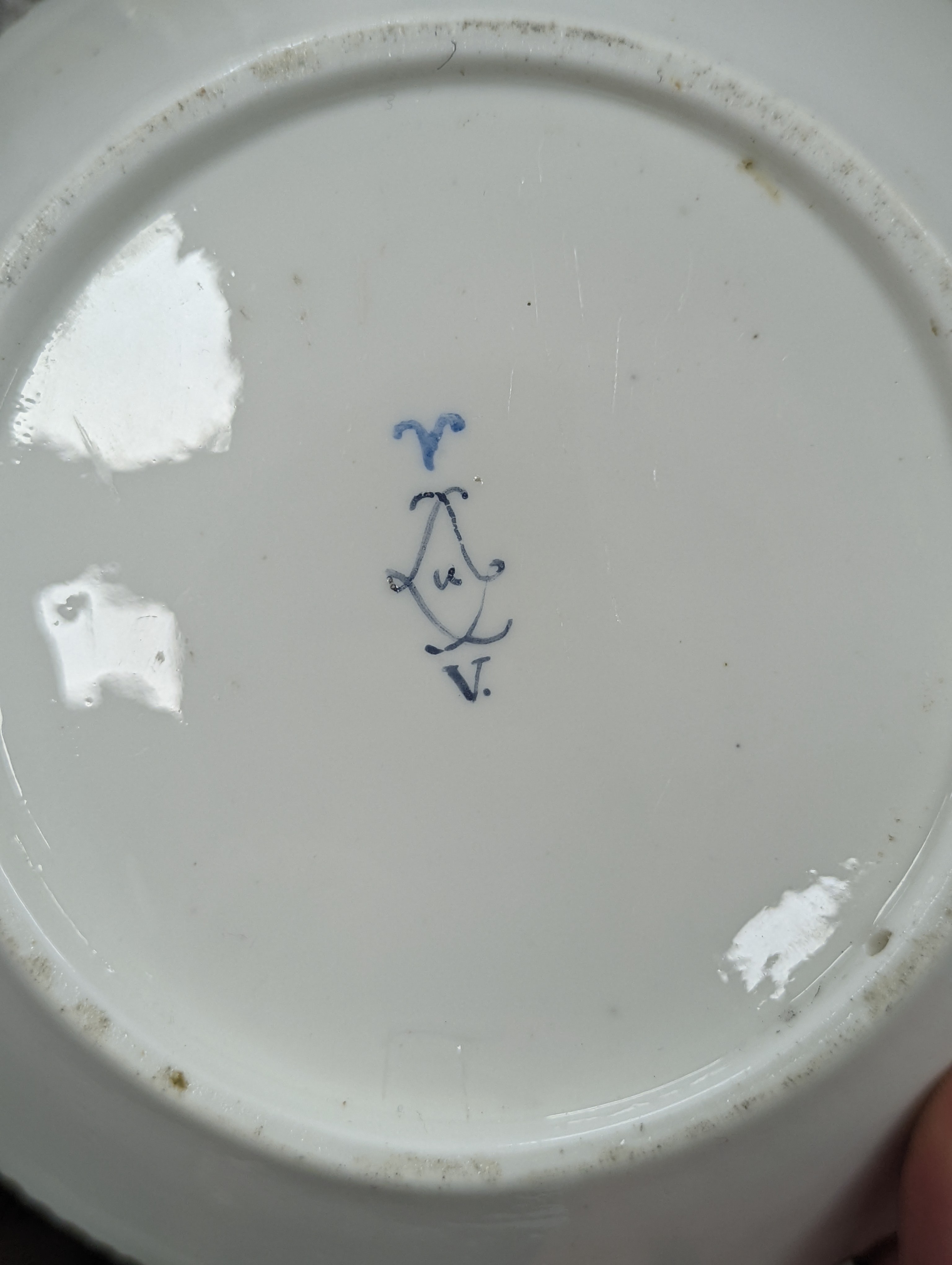 A Sevres tapering cup with entwined handle and cover and stand painted with flowers, date code for 1780, painters mark for Le Bel jnr., square incised marks, height 10.5cm